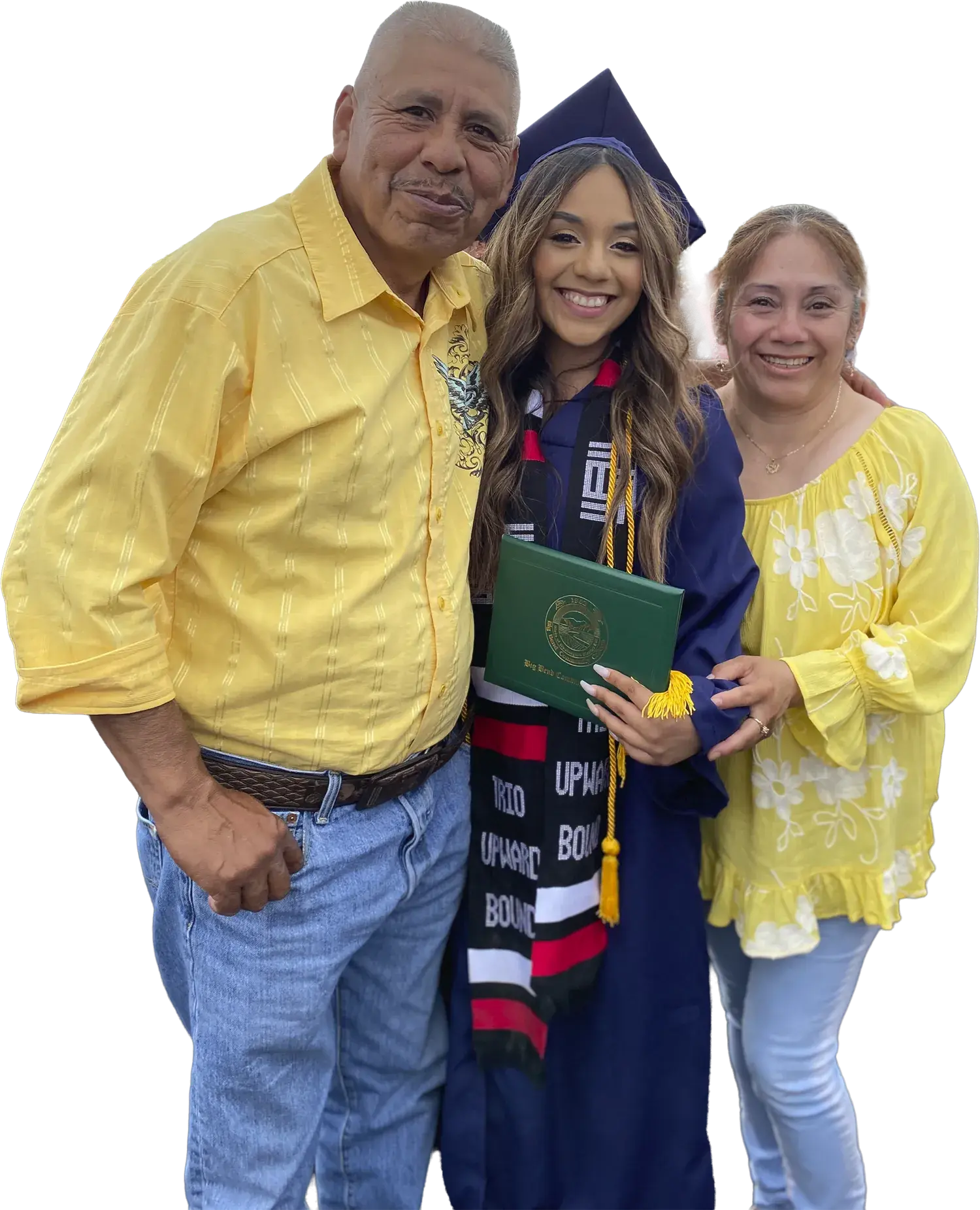 A WAEF scholarship graduate in cap and gown, holding her diploma between her two parents